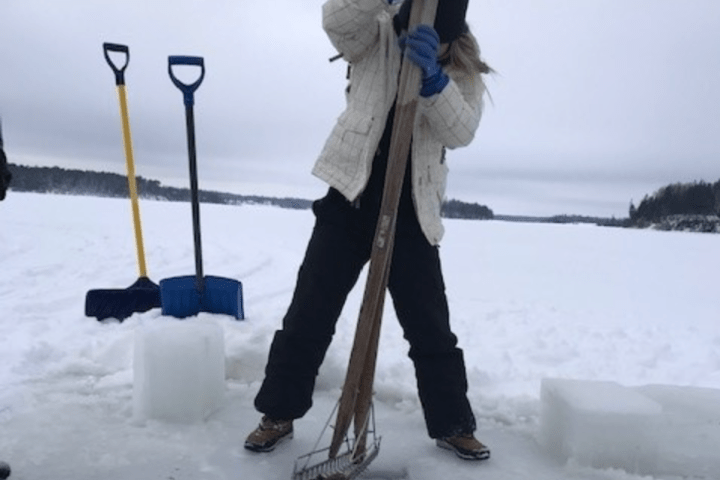 a couple of people that are standing in the snow