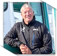 perrygotell-2018ed a man sitting in front of a screen