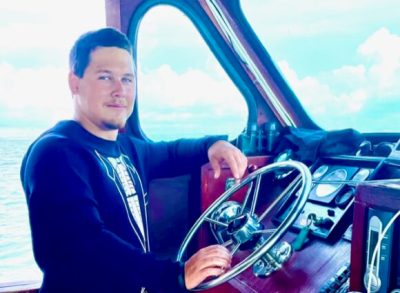 IMG_5670 a person standing next to a body of water